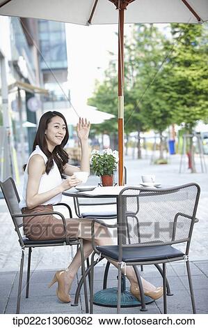 a woman drinking coffee View Large Photo Image Stock Image - a woman drinking coffee. Fotosearch