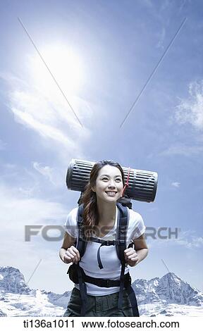 a woman hiking in the mountains View Large Photo Image Stock Image - a woman hiking in the mountains. Fotosearch