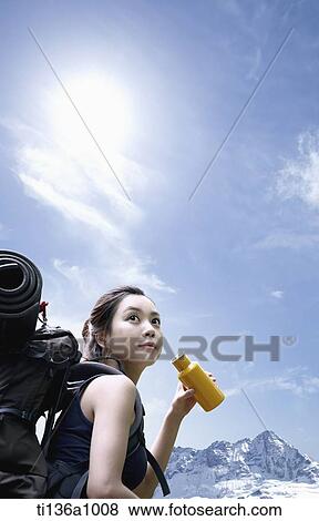 a woman hiking in the mountains View Large Photo Image Stock Photo - a woman hiking in the mountains. Fotosearch