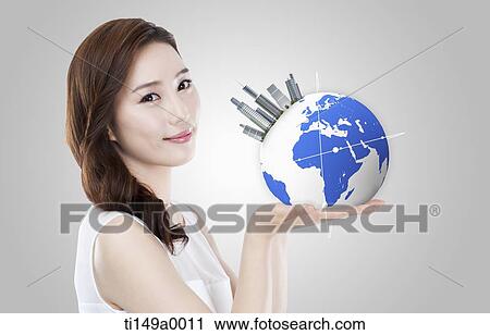 a woman holding a globe View Large Photo Image Stock Image - a woman holding a globe. Fotosearch