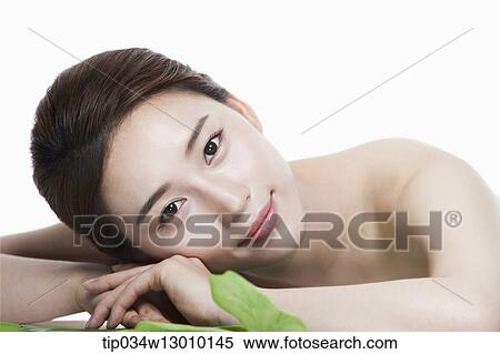 a woman in a white dress posing View Large Photo Image Stock Photography - a woman in a white dress posing. Fotosearch