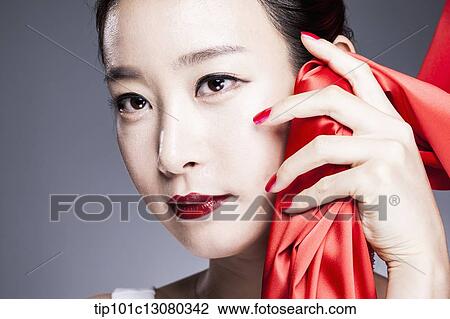 a woman in red lipstick posing with red curtain View Large Photo Image Stock Image - a woman in red lipstick posing with red curtain. Fotosearch