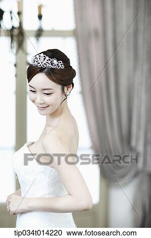 a woman in wedding dress looking back View Large Photo Image Stock Image - a woman in wedding dress looking back. Fotosearch