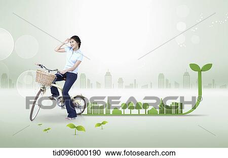 a woman riding a bike in green city View Large Photo Image Stock Image - a woman riding a bike in green city . Fotosearch