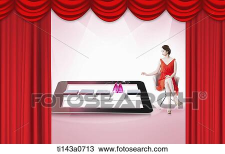 a woman sitting next to a tablet View Large Photo Image Stock Image - a woman sitting next to a tablet. Fotosearch