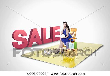 a woman sitting on a illustrated card View Large Photo Image Picture - a woman sitting on a illustrated card. Fotosearch