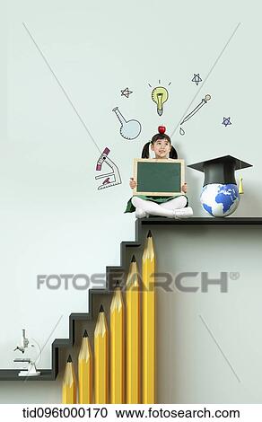 Stock Image - a woman sitting on top of stairs with pencils . Fotosearch