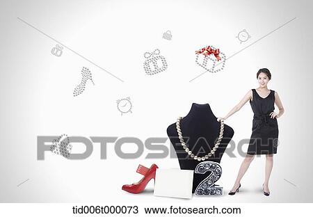 a woman standing next to a necklace View Large Photo Image Stock Image - a woman standing next to a necklace. Fotosearch