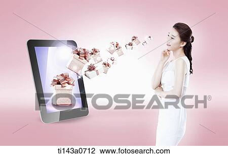 a woman standing next to a tablet View Large Photo Image Stock Image - a woman standing next to a tablet. Fotosearch