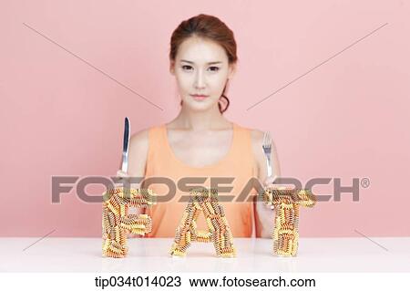 Stock Image - a woman with a word fat in front of her. Fotosearch