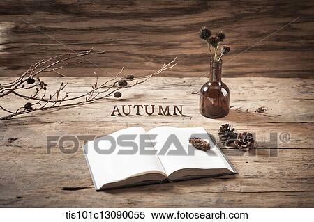 a word autumn on a wood surface with an open book View Large Photo Image Stock Photography - a word autumn on a wood surface with an open book. Fotosearch