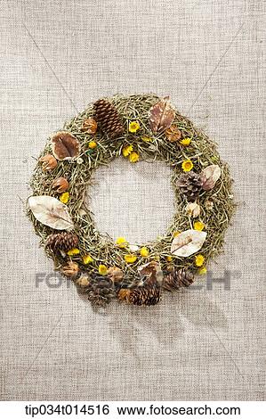 Stock Photograph - a wreath with autumn leaves and nuts . Fotosearch
