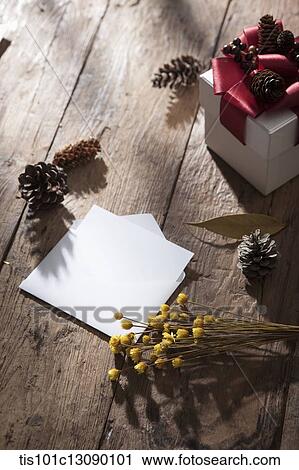 an envelop with autumn branches next to a gift box View Large Photo Image Stock Image - an envelop with autumn branches next to a gift box. Fotosearch