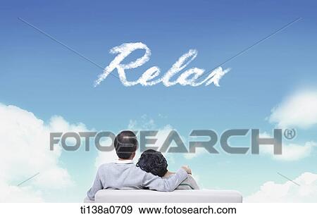 Stock Photo - an old couple sitting next to the word relax. Fotosearch
