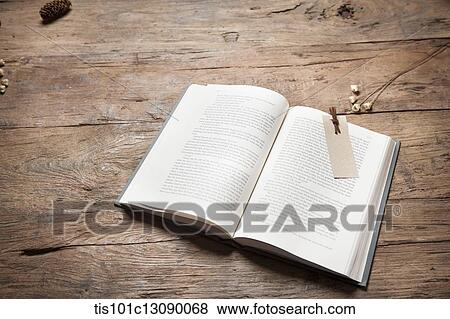 an open book on wooden desk View Large Photo Image Stock Photo - an open book on wooden desk. Fotosearch