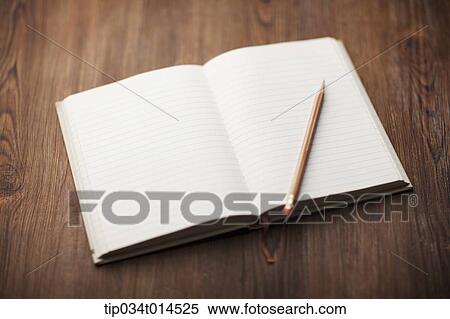 an open book on wooden surface View Large Photo Image Stock Photography - an open book on wooden surface. Fotosearch