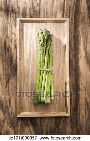 asparagus on a wooden board View Large Photo Image Stock Photo - asparagus on a wooden board. Fotosearch