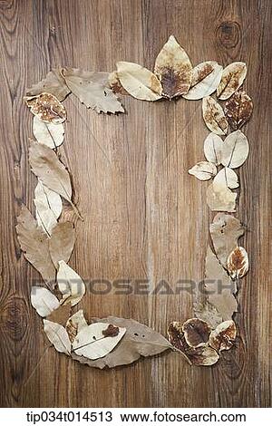 autumn leaves forming a frame in wood background View Large Photo Image Stock Image - autumn leaves forming a frame in wood background. Fotosearch