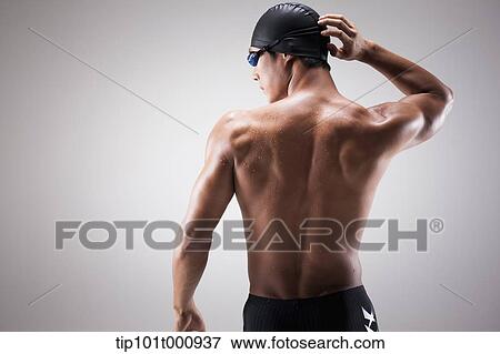back shot of a fit man with swimming goggle and hat View Large Photo Image Stock Photo - back shot of a fit man with swimming goggle and hat. Fotosearch