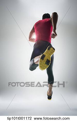 back shot of a runner running View Large Photo Image Stock Image - back shot of a runner running. Fotosearch