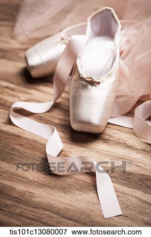 Stock Photo - ballet shoes on a wooden floor. Fotosearch