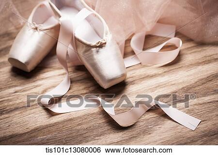 Stock Photograph - ballet shoes on a wooden floor. Fotosearch