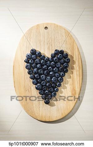 Stock Photo - blue berries making a heart shape. Fotosearch