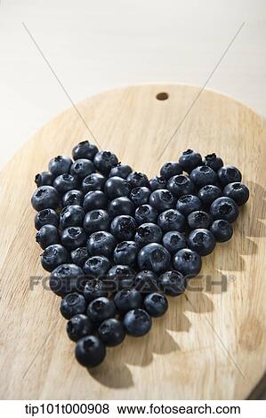 Stock Photo - blue berries making a heart shape. Fotosearch