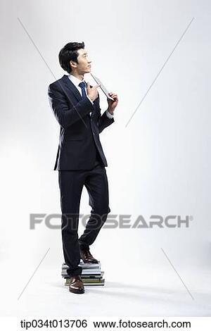Stock Photograph - businessman holding a tablet PC. Fotosearch
