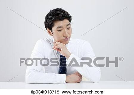 businessman sitting at a desk View Large Photo Image Stock Photography - businessman sitting at a desk. Fotosearch
