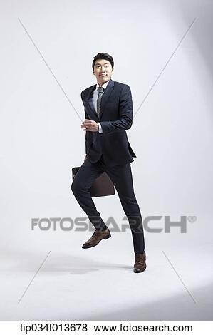 businessman with business bag running in hurry View Large Photo Image Stock Photo - businessman with business bag running in hurry . Fotosearch