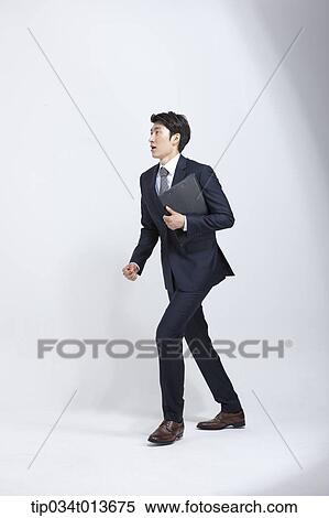 businessman with business bag walking in hurry View Large Photo Image Stock Photography - businessman with business bag walking in hurry . Fotosearch