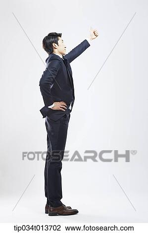 businessman with thumb up in the air View Large Photo Image Stock Image - businessman with thumb up in the air. Fotosearch
