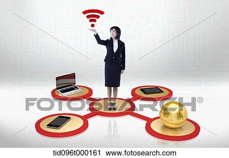 Stock Image - businesswoman with WI-FI sign. Fotosearch