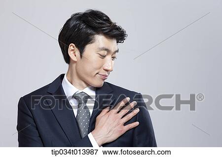 close up shot of a businessman touching his shoulder View Large Photo Image Stock Photo - close up shot of a businessman touching his shoulder. Fotosearch