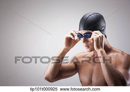 close up shot of a man with swimming goggle and hat View Large Photo Image Stock Photography - close up shot of a man with swimming goggle and hat. Fotosearch