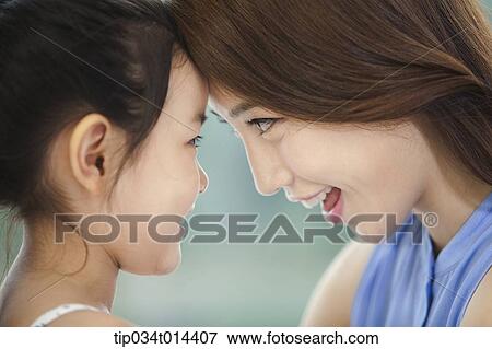 Stock Photo - close up shot of a mother and daughter. Fotosearch
