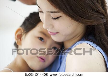 Stock Photo - close up shot of a mother and daughter. Fotosearch