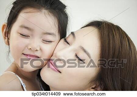 Stock Photo - close up shot of a mother and daughter. Fotosearch