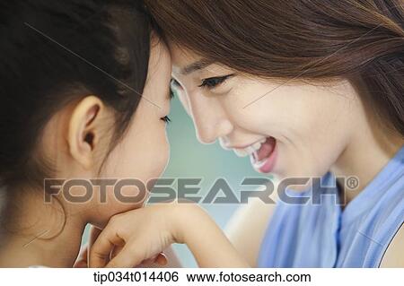 Stock Photograph - close up shot of a mother and daughter. Fotosearch
