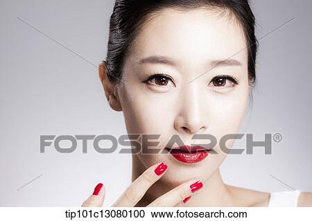 close up shot of a woman in red lipsticks and red nails View Large Photo Image Stock Image - close up shot of a woman in red lipsticks and red nails. Fotosearch