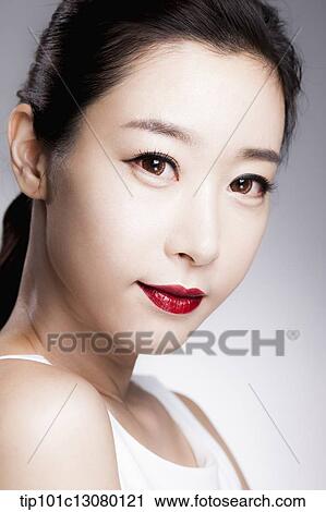 close up shot of a woman in red lipsticks and white top View Large Photo Image Stock Image - close up shot of a woman in red lipsticks and white top. Fotosearch