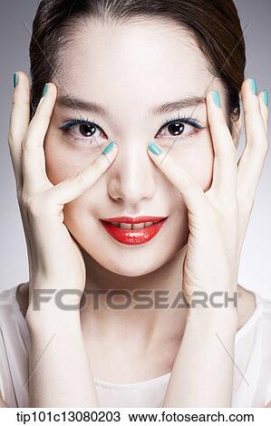 close up shot of a woman in red lipsticks and white top View Large Photo Image Stock Image - close up shot of a woman in red lipsticks and white top. Fotosearch