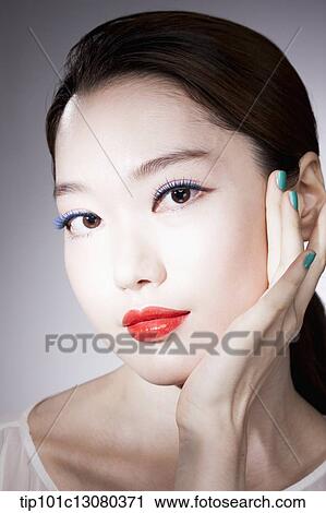Stock Image - close up shot of a woman in red lipsticks. Fotosearch