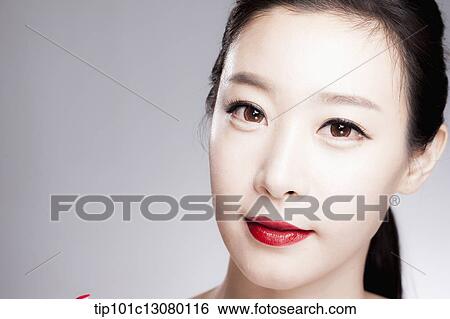 Stock Photograph - close up shot of a woman in red lipsticks. Fotosearch