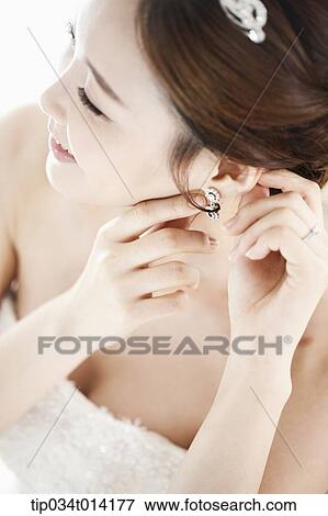 Stock Photo - close up shot of a woman in wedding hair. Fotosearch