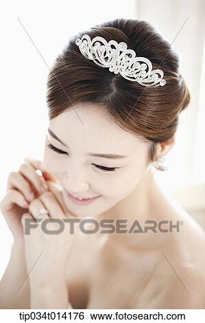 Stock Photograph - close up shot of a woman in wedding hair. Fotosearch