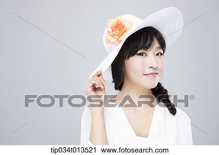 close up shot of a woman in white hat posing View Large Photo Image Stock Image - close up shot of a woman in white hat posing . Fotosearch