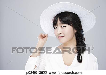 close up shot of a woman in white hat posing View Large Photo Image Stock Image - close up shot of a woman in white hat posing . Fotosearch
