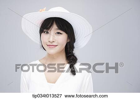 close up shot of a woman in white hat posing View Large Photo Image Stock Photo - close up shot of a woman in white hat posing . Fotosearch